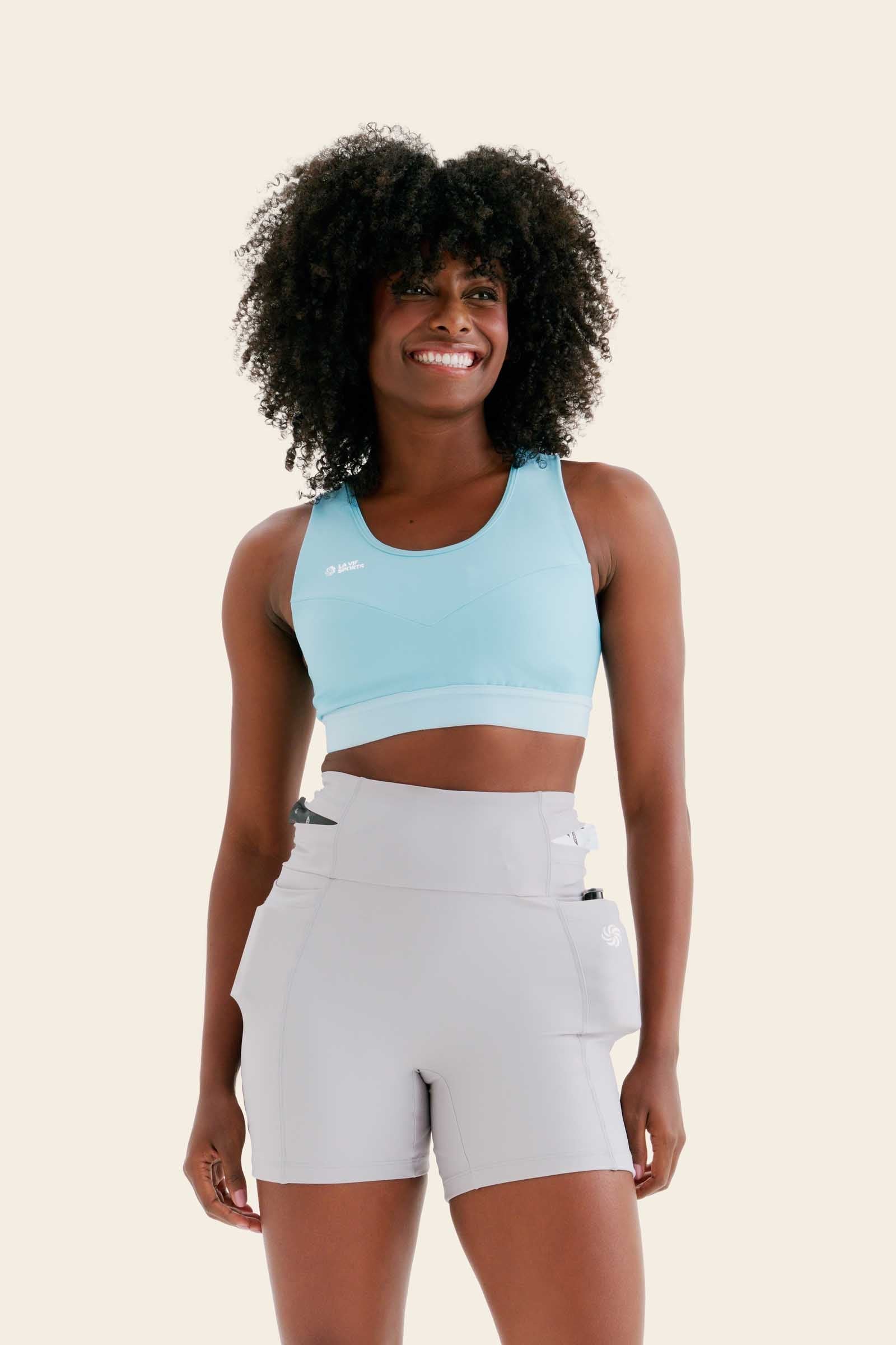 TOP DE COMPRESSÃO COM BOLSO RECORTES TOTAL EMANA BRISA