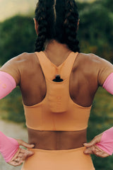 TOP DE COMPRESSÃO COM SUPER BOLSO ZERO ATRITO FlexSkin™ LARANJA